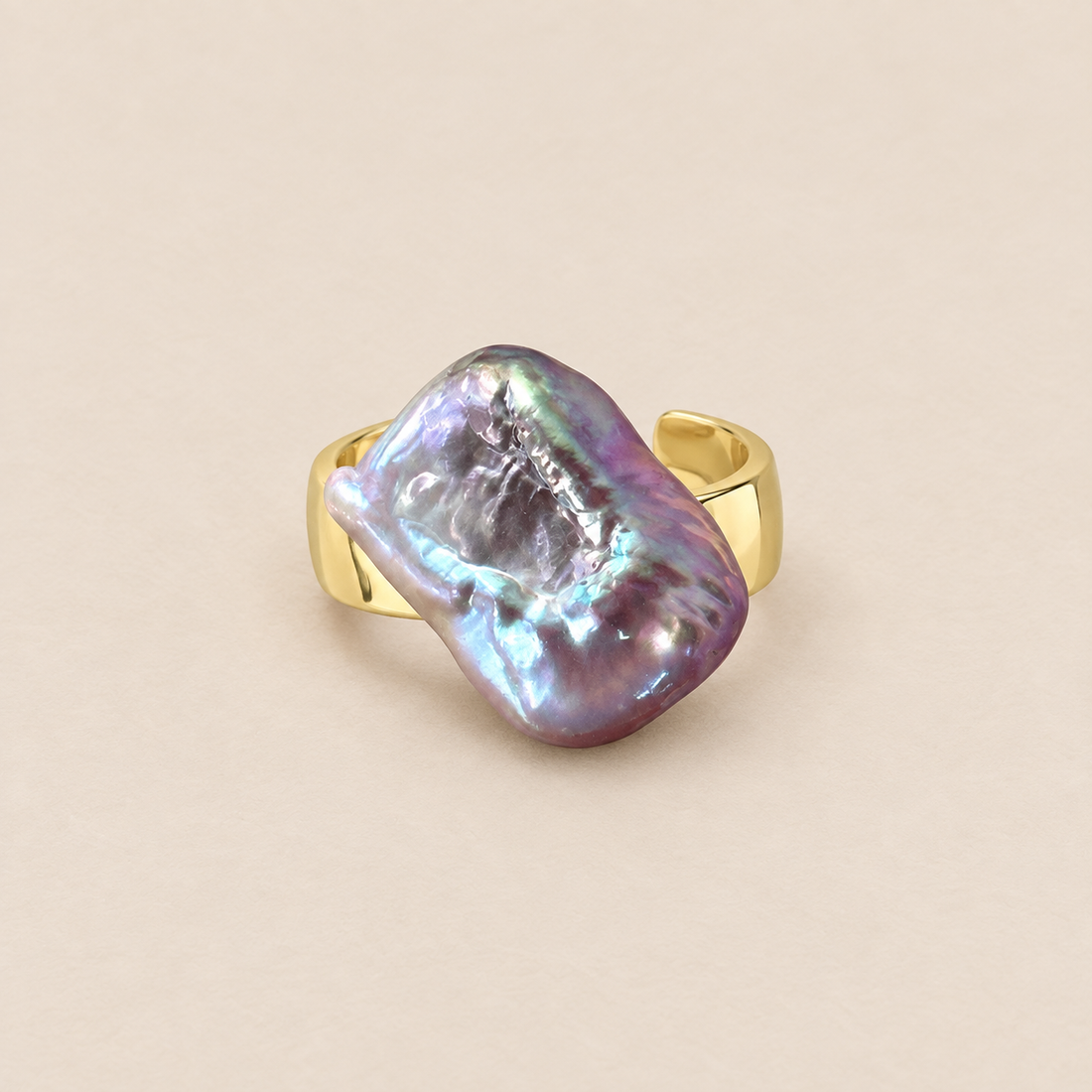 Odette 18K Gold-Plated Adjustable Baroque Pearl Ring on a warm beige background