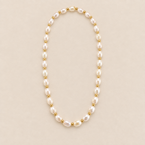 Aurelia Freshwater Pearl & 18K Gold-Plated Bead Necklace on a warm beige background