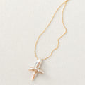 Celeste Gold-Plated Pearl Cross Necklace — product view 1